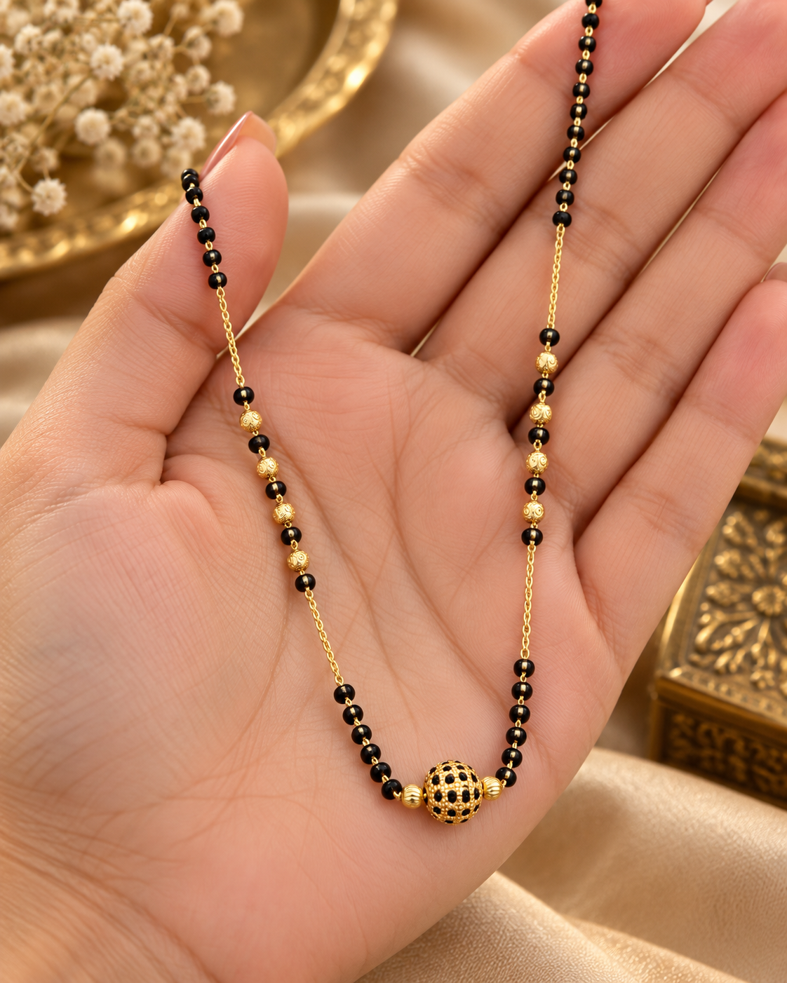 Jivaanik Elegant Black Beads Gold Ball Mangalsutra with Golden Chain Detailing for Women
